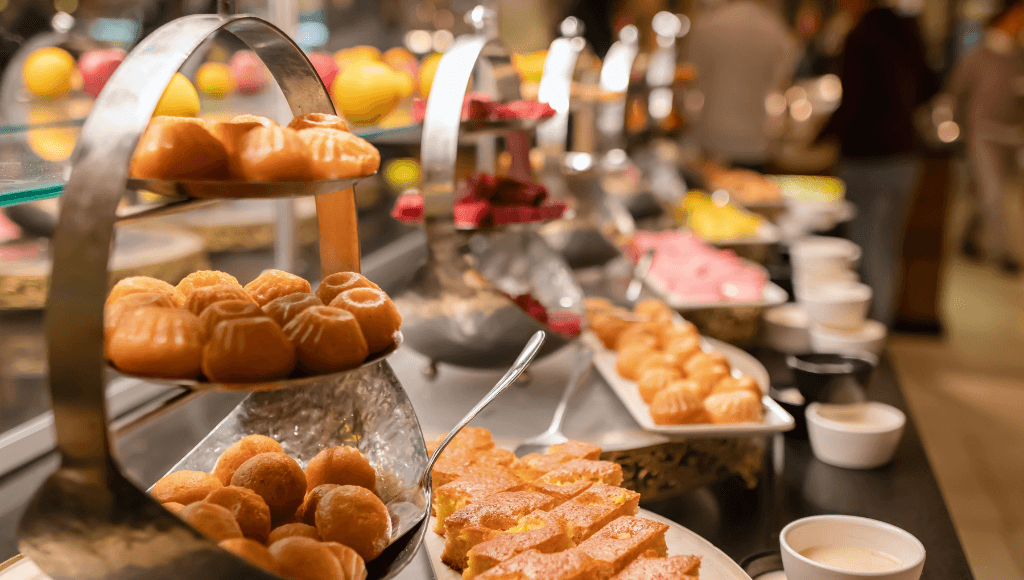 An array of beautifully displayed desserts and pastries at a gourmet all-inclusive resort buffet